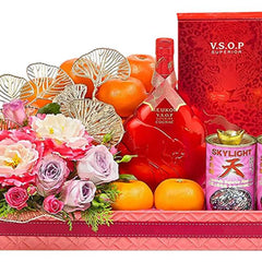 Chinese New Year hamper with flowers, oranges, VSOP bottle, and festive gifts for delivery