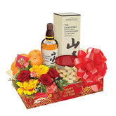 Chinese New Year flower hamper with fresh roses, festive fruits, and gift delivery arrangement