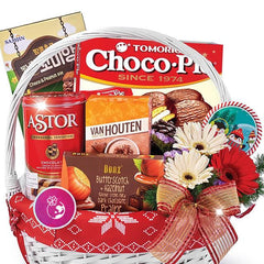 Festive flower delivery gift basket with chocolate, snacks, and fresh gerbera flowers