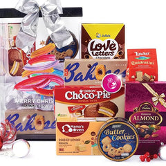 Festive gift hamper with assorted chocolates, cookies, and biscuits for delivery