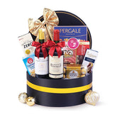 Elegant festive hamper with wine, chocolates, and gourmet treats for flower delivery in Singapore