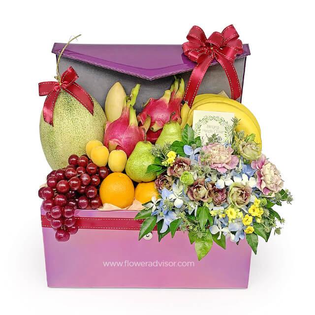 Fresh flower and fruit basket with orchids, roses, and assorted fruits for delivery