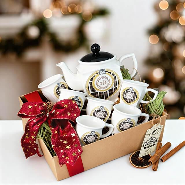 Elegant tea gift set with teapot and cups, festive bow, ideal for flower delivery gift