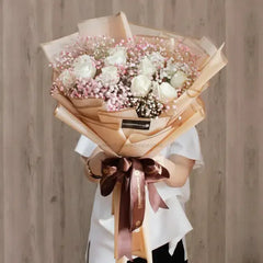 Elegant bouquet of 12 white roses and pink baby’s breath for flower delivery