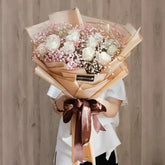 Elegant bouquet of 12 white roses with pink baby's breath for flower delivery
