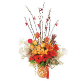 Fresh flower arrangement with orange roses and gerberas, perfect for festive flower delivery.
