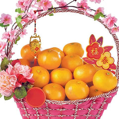 Mandarin orange basket with pink flowers, ideal for festive flower delivery in Singapore