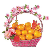 Mandarin orange gift basket with pink flowers for festive flower delivery
