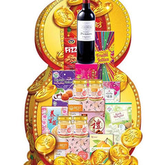 Gift hamper with wine, snacks, and festive gold coin decorations, ideal for flower delivery gifts.