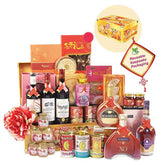 Luxury hamper with wine, spirits, gourmet treats and a decorative flower, for festive flower delivery.