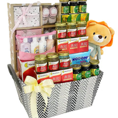 Baby gift hamper with plush toy, health supplements, baby care products and ribbon, flower delivery