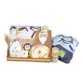 Baby gift hamper with clothes, feeding set, and soft toys, ideal for new baby flower delivery