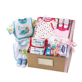 Baby gift hamper with baby clothes, wipes, socks, bibs and essentials for flower delivery
