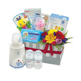 Baby hamper with fresh flower arrangement, feeding bottles, wipes, and baby care gifts for delivery