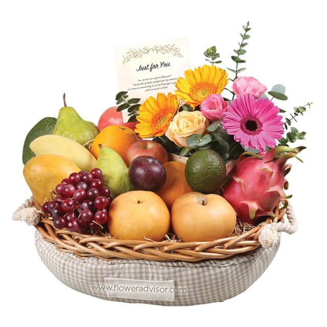 Flower delivery hamper with assorted fresh fruits and vibrant floral arrangement