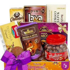 Gift hamper with assorted chocolates, cookies, nuts and festive bow for delivery.