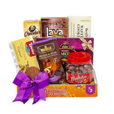 Delectable gift hamper with assorted chocolates and snacks, ideal for festive flower delivery