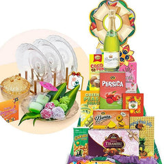 Festive hamper with assorted snacks, glassware, and treats for gift or flower delivery.