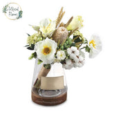 Artificial flower arrangement in a glass vase for flower delivery in Singapore