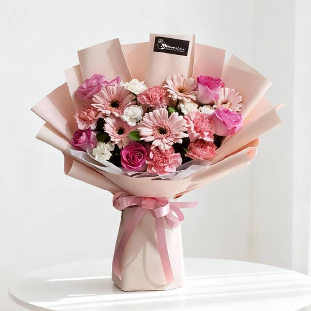 Pink and white bouquet with roses, carnations, and gerberas for same-day flower delivery