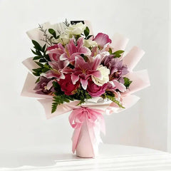 Romantic pink and white flower bouquet with lilies and roses for flower delivery