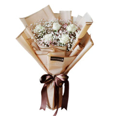 Elegant hand bouquet with six white roses and baby's breath for flower delivery Singapore