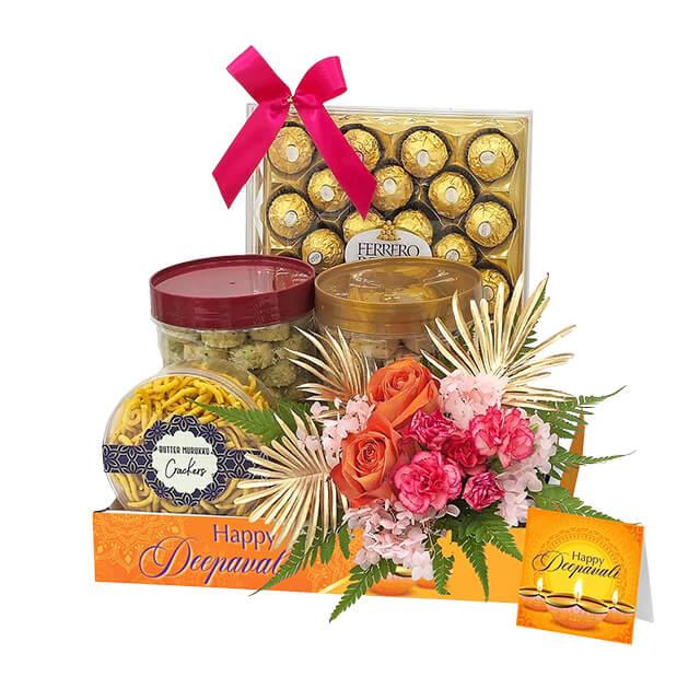 Diwali hamper with fresh flower bouquet, snacks, chocolates, ideal for festive flower delivery