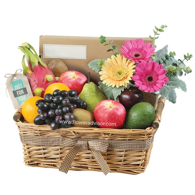 Flower and fresh fruit basket for delivery, featuring gerbera daisies and assorted fruits