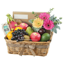 Flower and fresh fruit basket for delivery, featuring gerbera daisies and assorted fruits