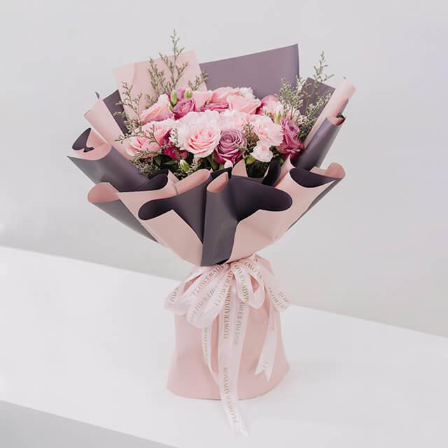 Elegant pink rose bouquet with wrapping, ideal for same-day flower delivery in Singapore