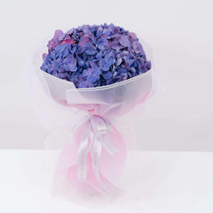 Purple hydrangea bouquet with pink wrapping, ideal for same-day flower delivery in Singapore