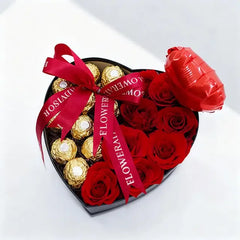 Heart-shaped box with red roses and chocolates for flower delivery