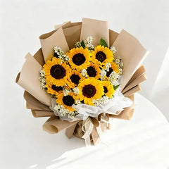 Bright sunflower bouquet wrapped in brown paper, perfect for same-day flower delivery across Singapore