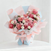 Elegant bouquet of pink roses and white flowers, ideal for flower delivery in Singapore