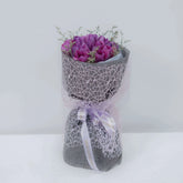 Purple tulip bouquet with decorative wrap, ideal for flower delivery in Singapore
