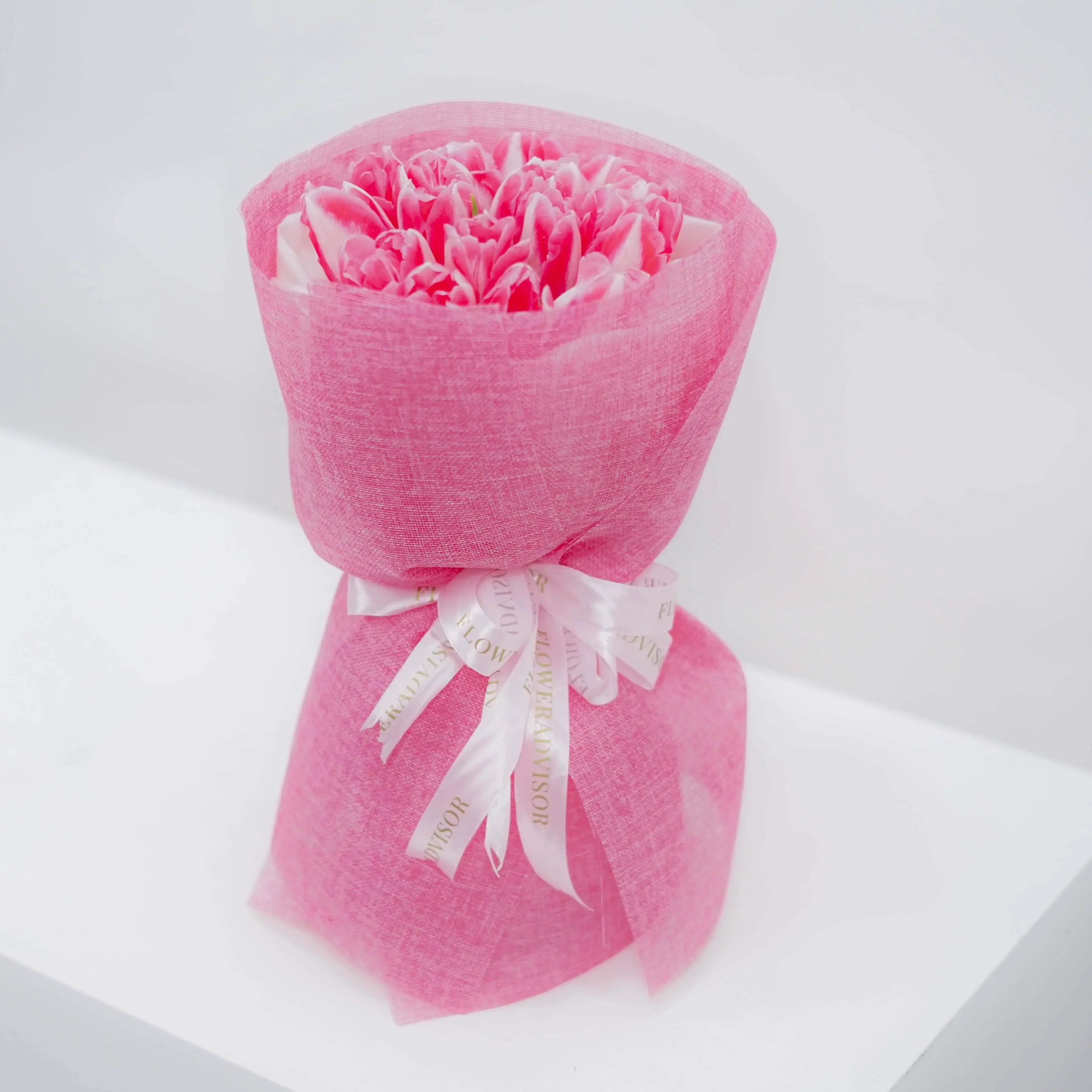Pink tulip bouquet with decorative ribbon, ideal for flower delivery in Singapore