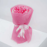 Pink tulip bouquet with decorative ribbon, ideal for flower delivery in Singapore