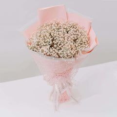 Pink baby's breath bouquet in pastel wrapping, ideal for flower delivery in Singapore