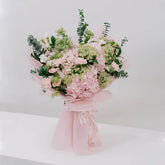 Elegant pink hydrangea bouquet wrapped for flower delivery in Singapore