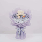 Purple baby's breath bouquet with plush bear, perfect for flower delivery in Singapore