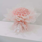 Large bouquet of 50 pink roses in soft wrapping, perfect for flower delivery in Singapore