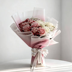 Elegant bouquet of pink and white roses with baby's breath, perfect for flower delivery in Singapore