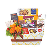 Flower delivery gift hamper with orange roses, chocolates, cookies, and sweet treats