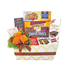 Flower delivery gift hamper with orange roses, chocolates, cookies, and sweet treats