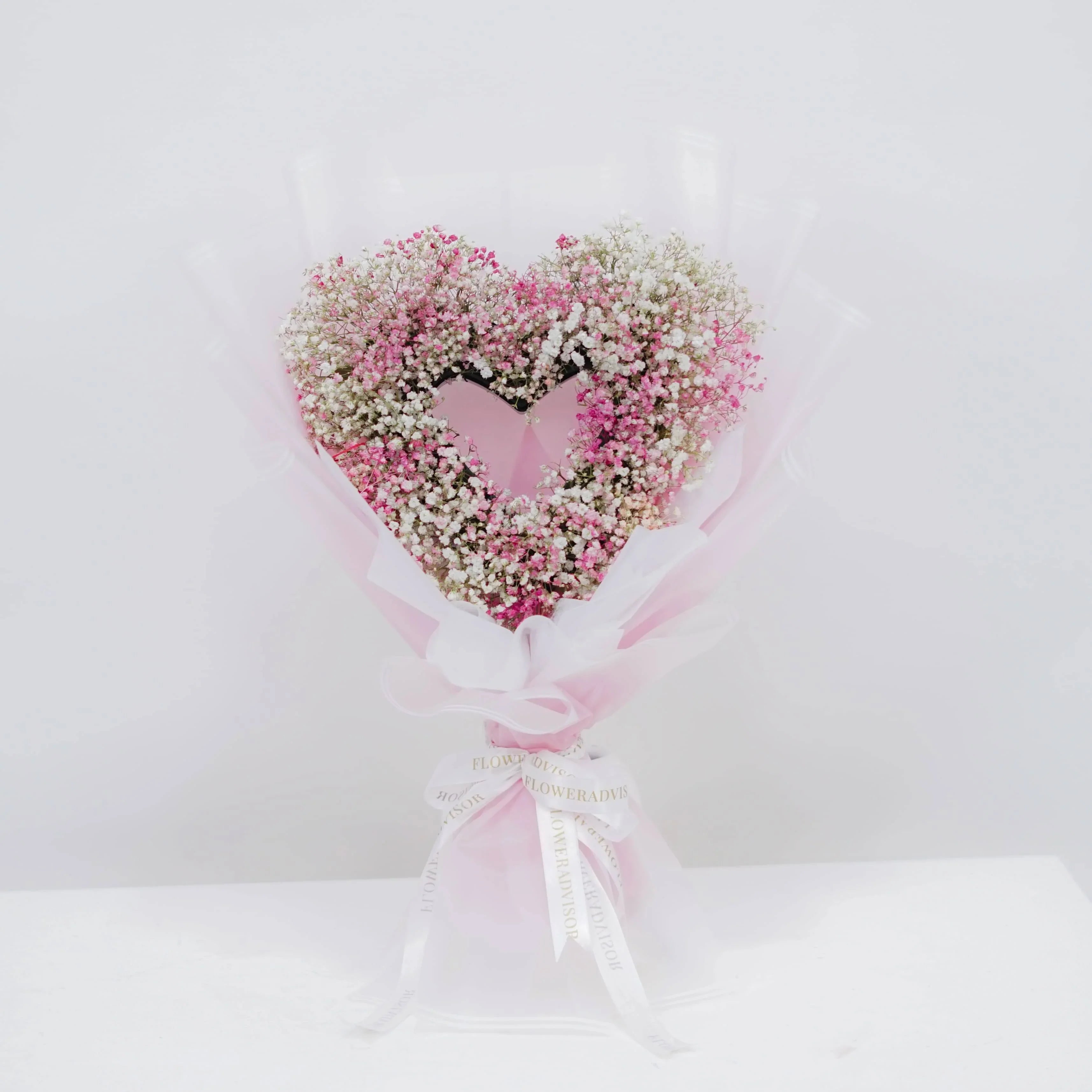 Heart-shaped pink and white baby’s breath bouquet, ideal for flower delivery gift