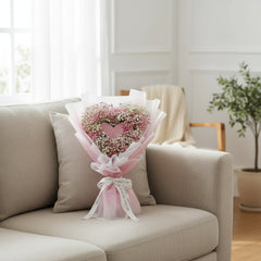 Heart-shaped baby's breath bouquet wrapped in pink, perfect for same-day flower delivery in Singapore