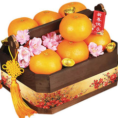 Mandarin oranges gift basket with pink flowers and festive decor for flower delivery