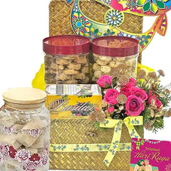 Hari Raya hamper with cookies, pink flower bouquet, and festive card for flower delivery