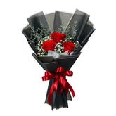 Elegant red rose bouquet with black wrapping, perfect for flower delivery in Singapore