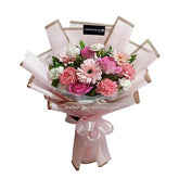 Pink and white flower bouquet with ribbon, perfect for flower delivery in Singapore